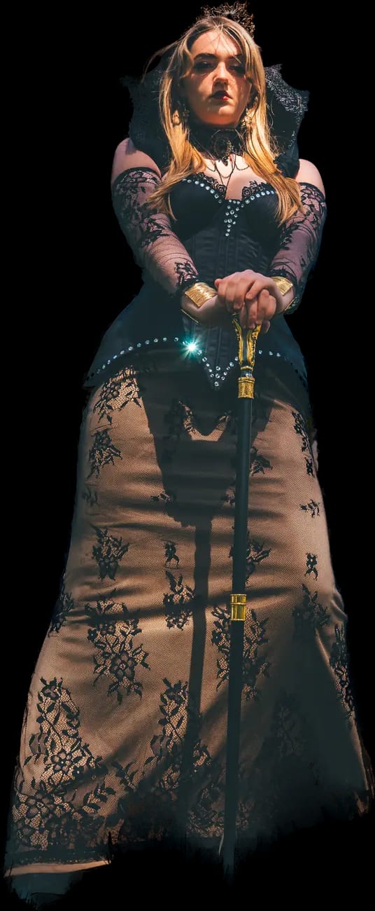 The Empress cut out of her photograph: a dark crown, a black corseted gown and both hands on a staff.
